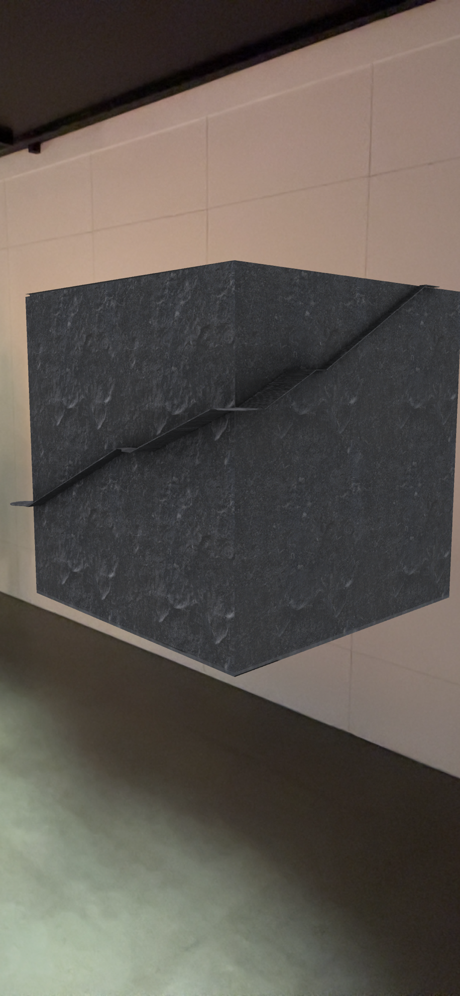 A gray cubic sculpture